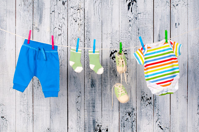 baby clothes on a clothing line outside