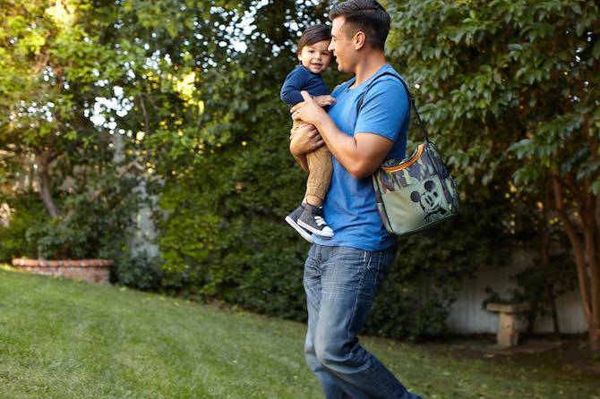 Dad carrying baby boy