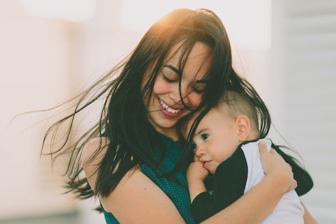 Mother embracing her child