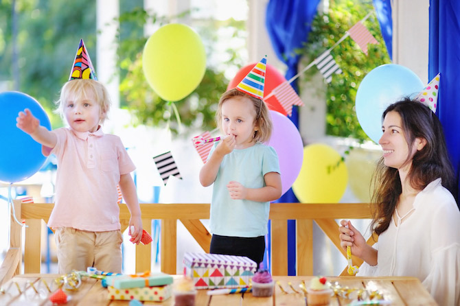 Kids and mom at birthday party outdoors