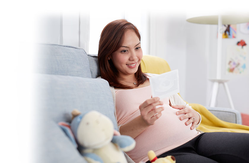 Pregnant mom looking at her ultrasound picture
