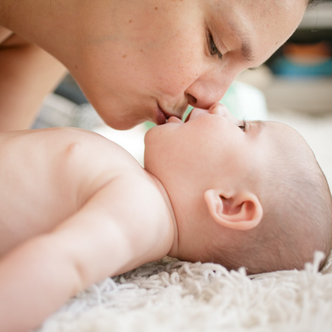 ​Newborn baby in mom's lap