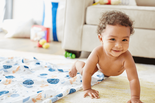 baby boy crawling on floor